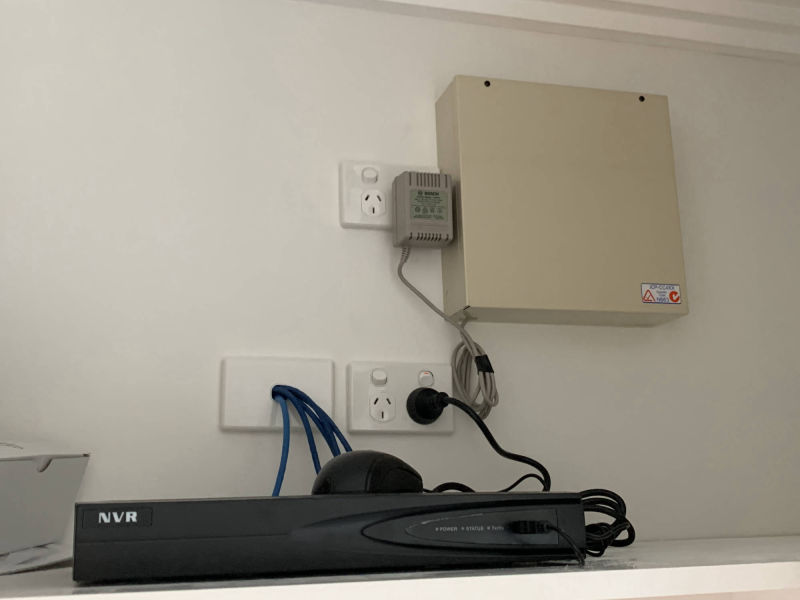 Photo of Bosch Alarm panel plugged in power point and Hikvision POE CCTV recorder